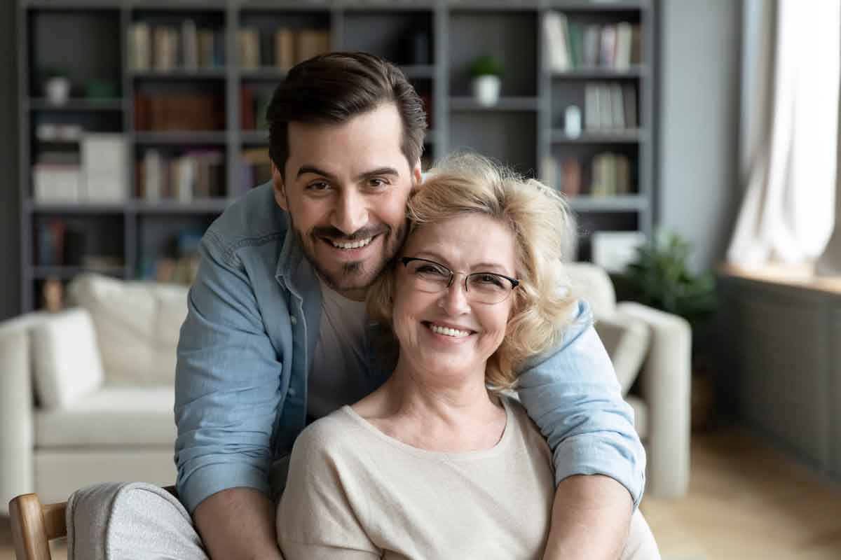 an image of an adult child caring for an aging parent